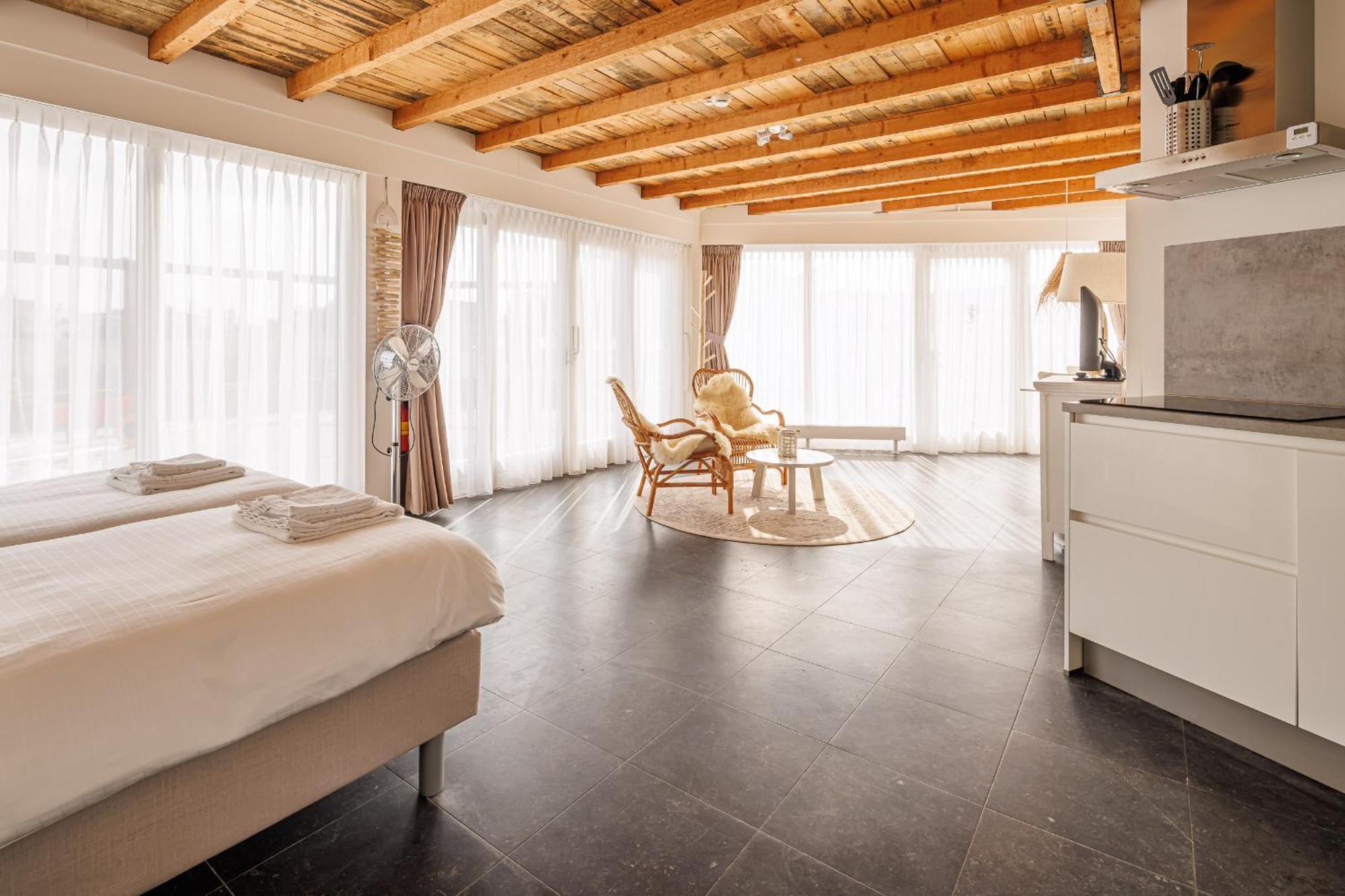 Neptunus Appartementen แบร์เกิน อาน ซี ห้อง รูปภาพ