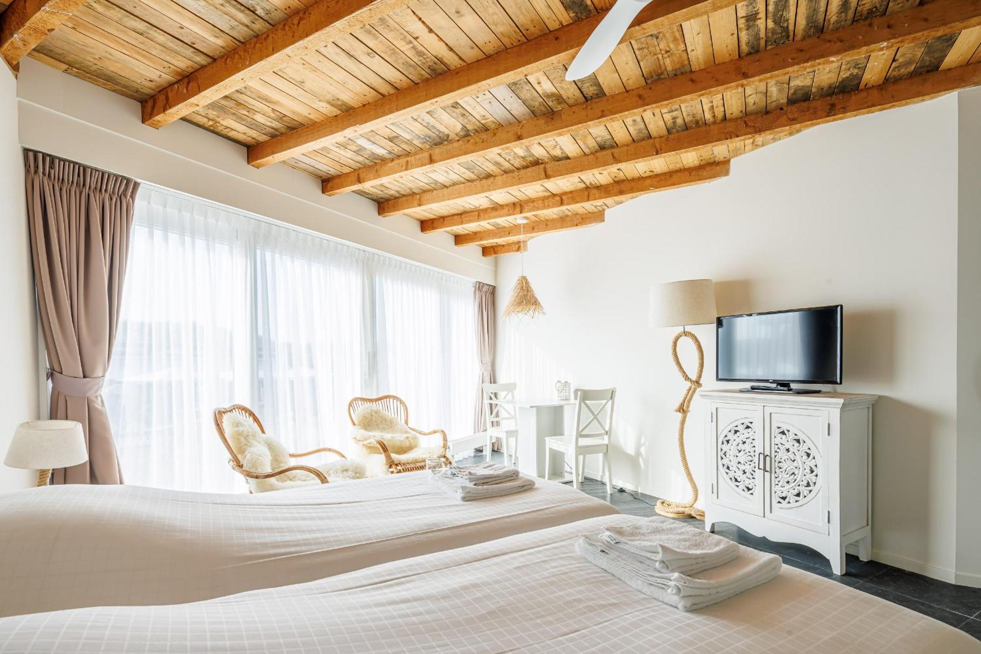 Neptunus Appartementen แบร์เกิน อาน ซี ห้อง รูปภาพ